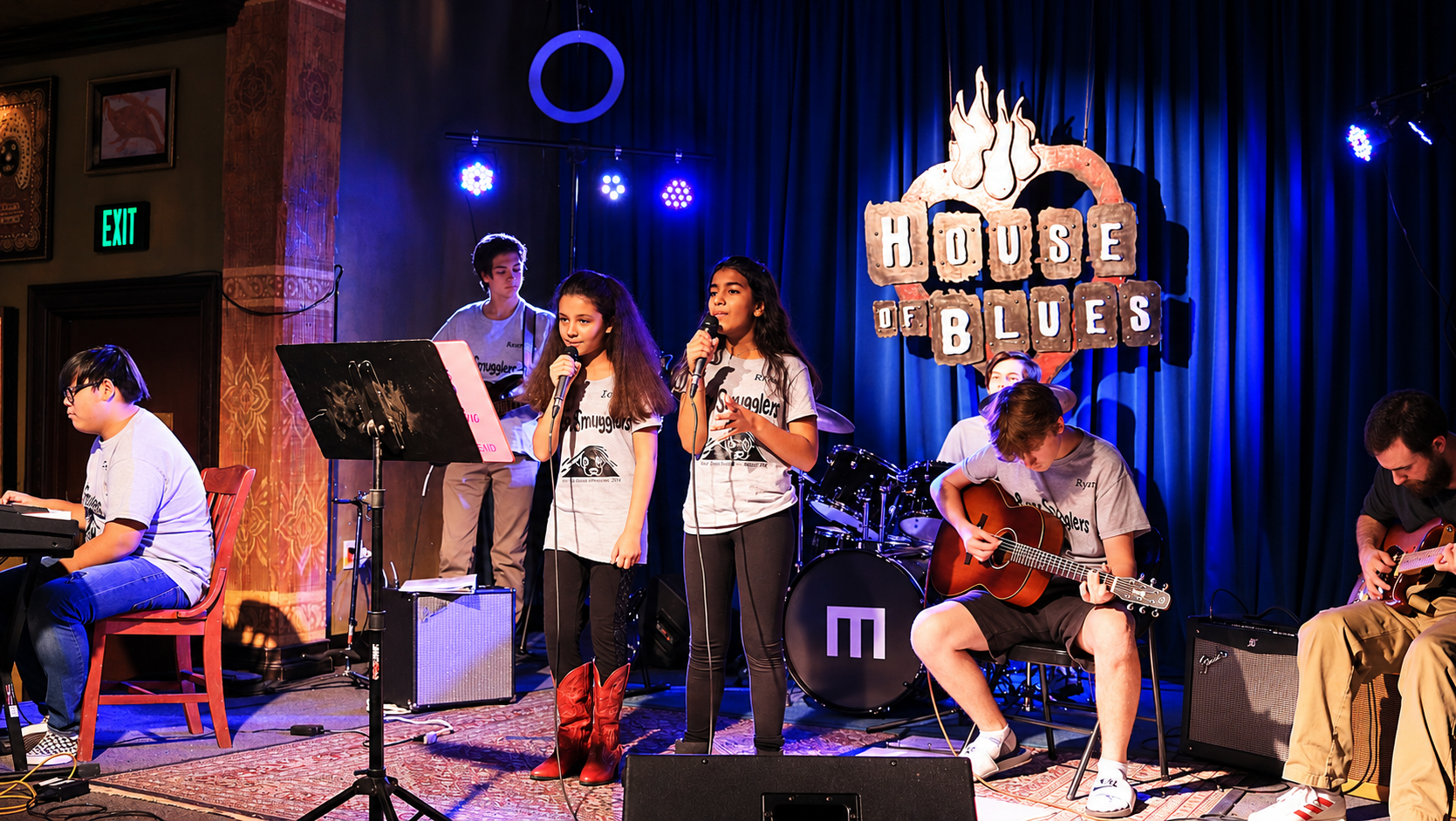 MBMS student band performing with singers, guitars and drums at House of Blues