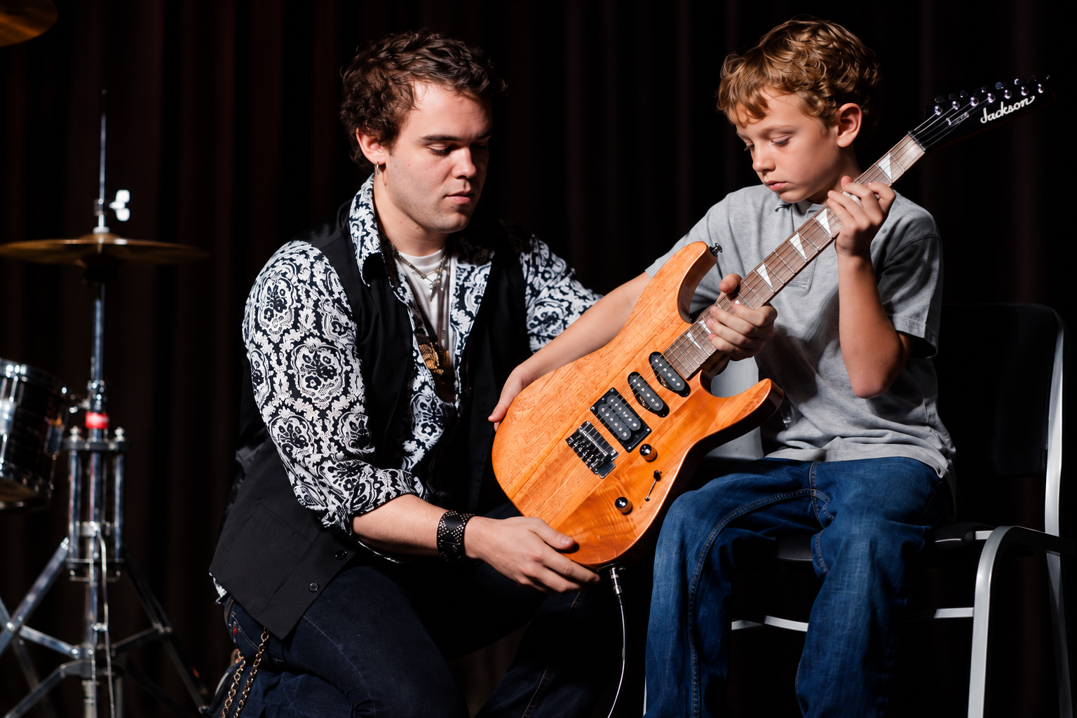 Guitarist and drummer performing together · MBMS archive