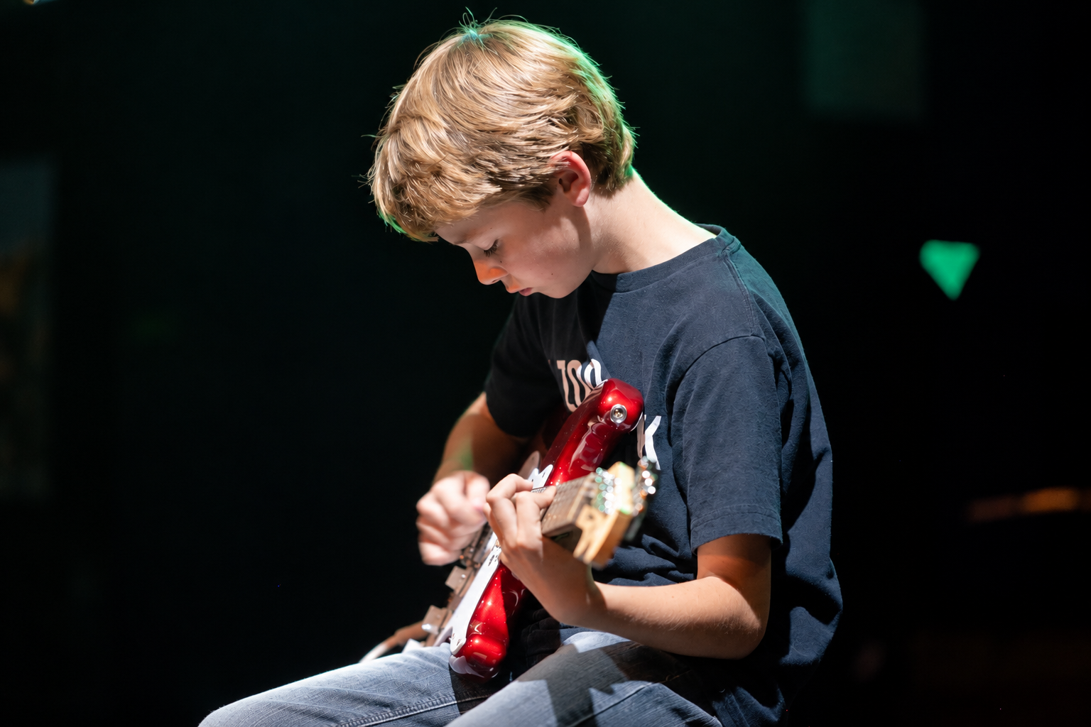 Young guitarist playing electric guitar · MBMS archive