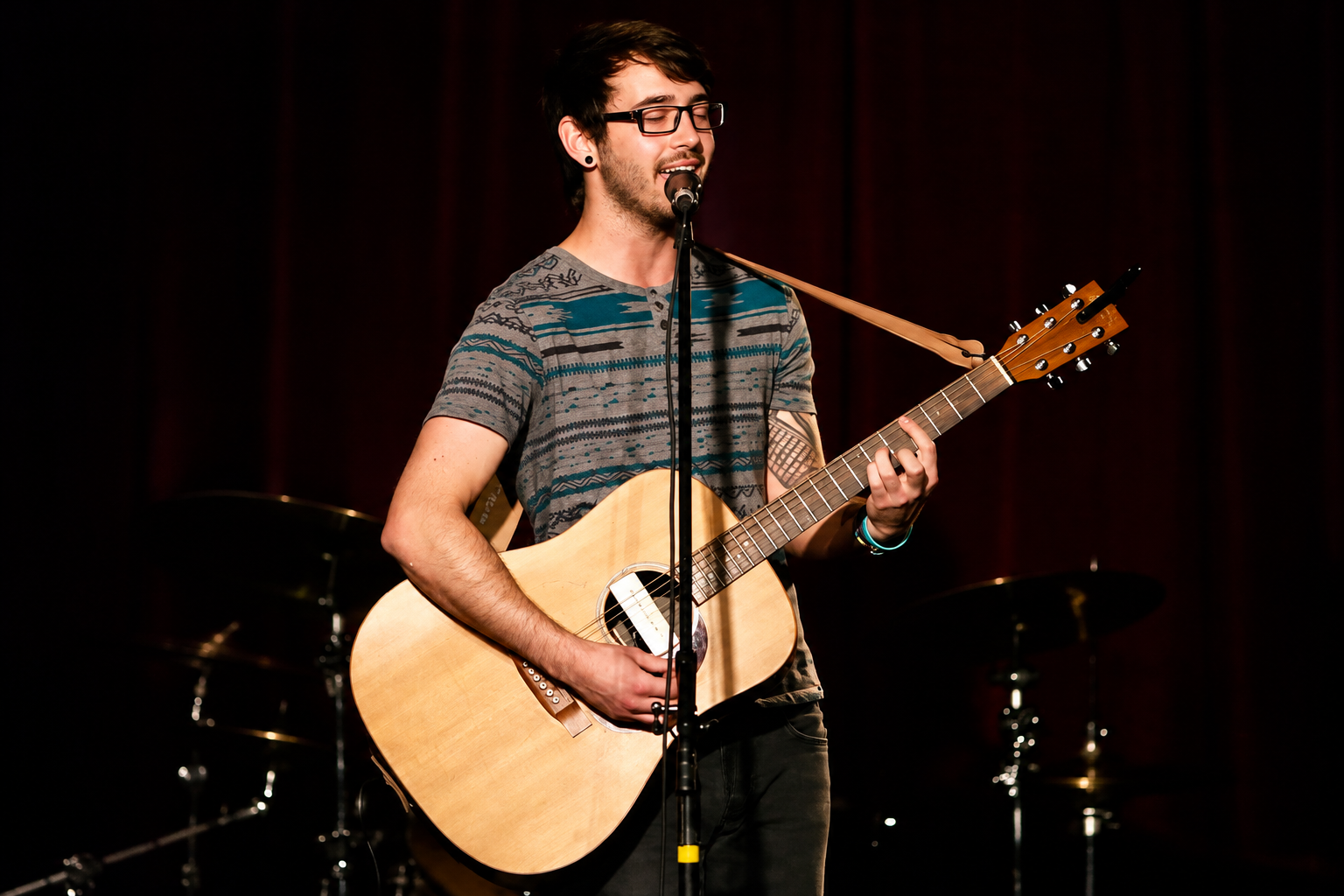 Guitarist singing into a microphone · MBMS archive