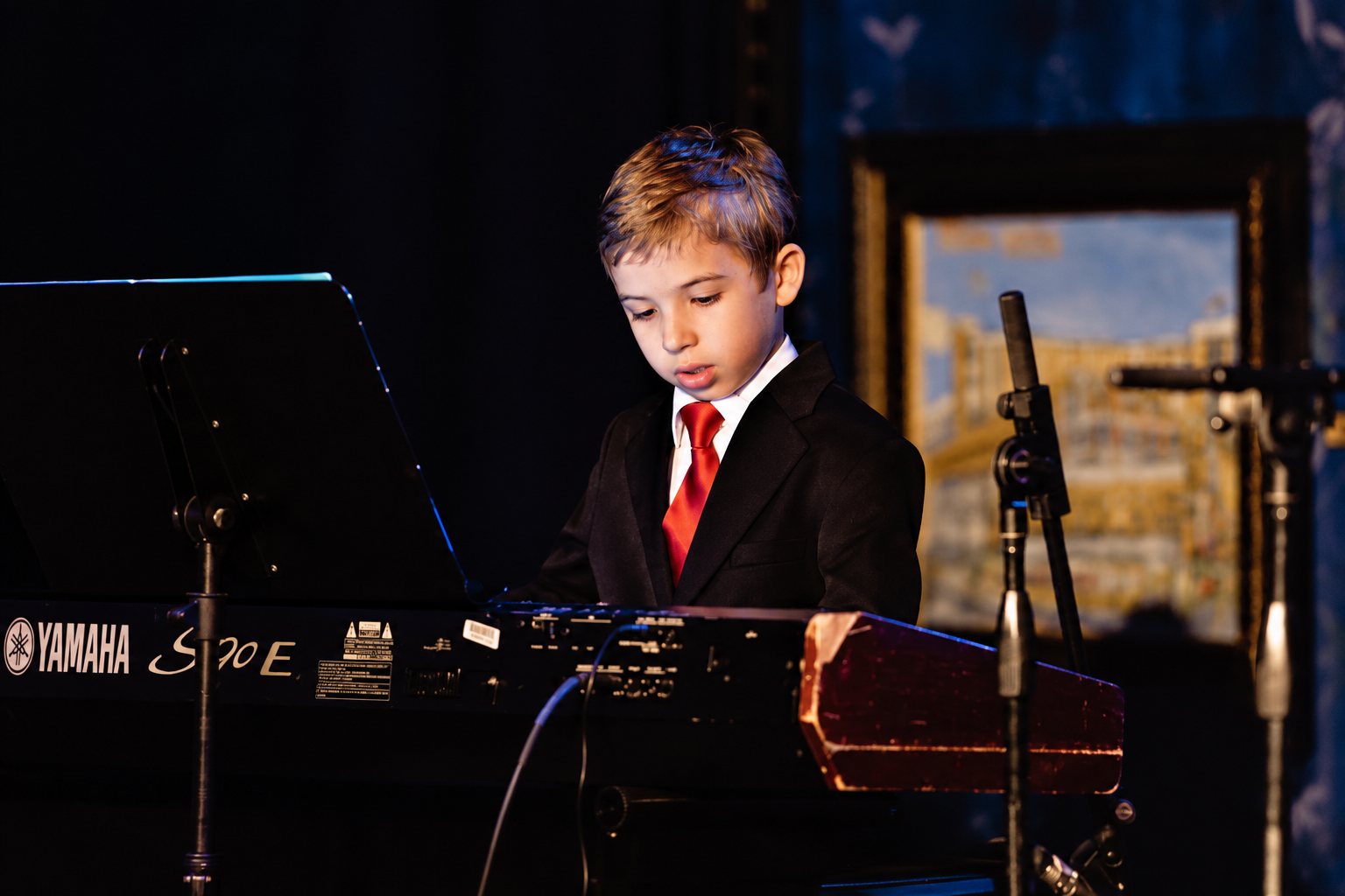 Pianist performing with sheet music · MBMS archive
